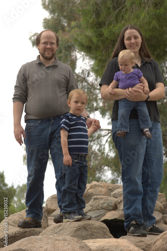 Photo: Family of 4 standing on rocks Family of 4 standing on rocks