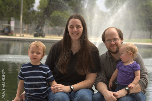 Photo: Family of 4 with fountain behind Family of 4 with fountain behind