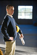 Young man looking at empty office space ready for buildout