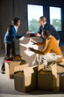 Multi-ethnic businesspeople preparing new office space