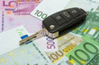 Car key on money background.