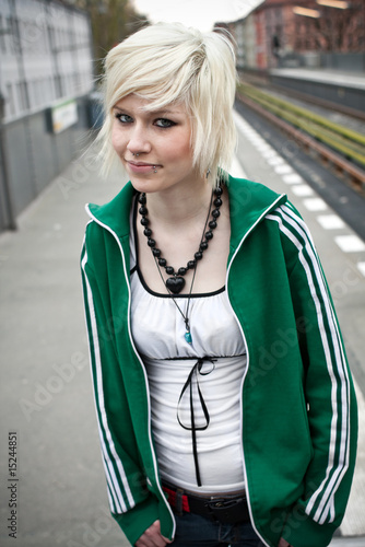 Photo: portrait of beautiful woman waiting for the train portrait of beautiful woman waiting for the train