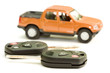 Photo: Macro picture of car key with truck as the background Macro picture of car key with truck as the background