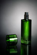 A single green bottle of perfume A single green bottle of perfume