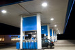 Blue filling station at night
