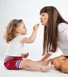 Foto: Daughter put on lipstick Daughter put on lipstick