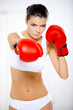 Young beautiful woman during fitness time and boxing