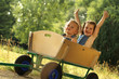 Photo: 2 Cute little girls in a cart 2 Cute little girls in a cart