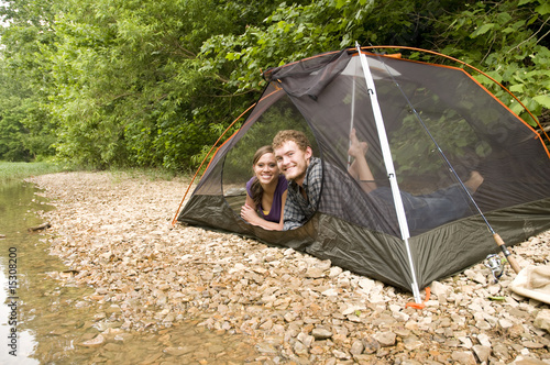 Photo: Couple camping in a tent Couple camping in a tent