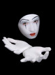 mime in white gloves on black background mime in white gloves on black background
