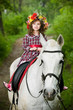 Cute little girl in floral wreath