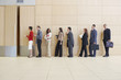 Businesspeople in line up