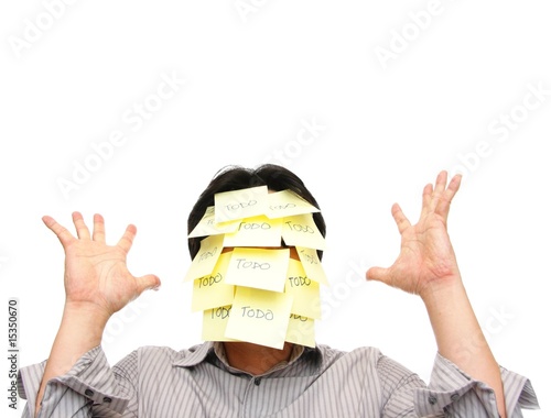 Photo: Man with face covered with todo notes, hands raised up Man with face covered with todo notes, hands raised up