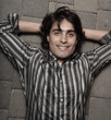 Photo: Handsome male against a abstract brick backround Handsome male against a abstract brick backround