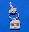 chrome house key on blue background chrome house key on blue background