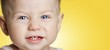 baby girl with blue eyes smiling