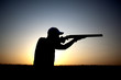 Shooting with a gun silhouette