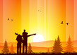 Happy family at sunset