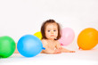 baby with balloons birthday on colorful celebration party