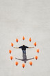 Man standing in circle of traffic cones with arms up
