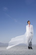 Man outdoors ensnared in a sheer sheet