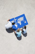 Aerial View of three people with pieces of world map puzzle outdoors