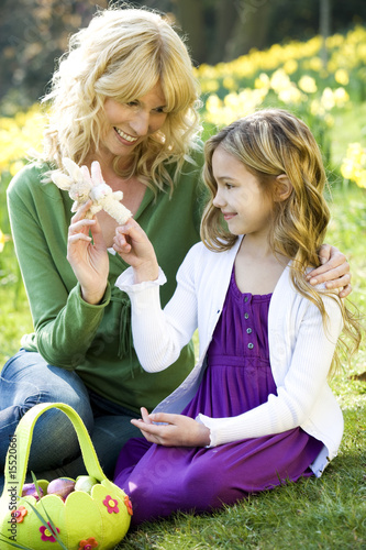 Photo: Mother and Daughter Looking at Toy Easter Bunny Mother and Daughter Looking at Toy Easter Bunny