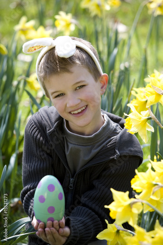 Photo: Young Boy Holding Easter Egg Smiling Young Boy Holding Easter Egg Smiling