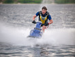 Man on jet ski rides fast