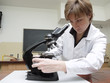Biology teacher with microscope