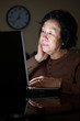 senior asian lady working late