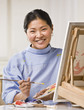 Woman Painting Picture