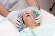Beautiful patient receives anaesthetic