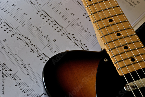 Photo: Electric Guitar and Sheet Music Electric Guitar and Sheet Music