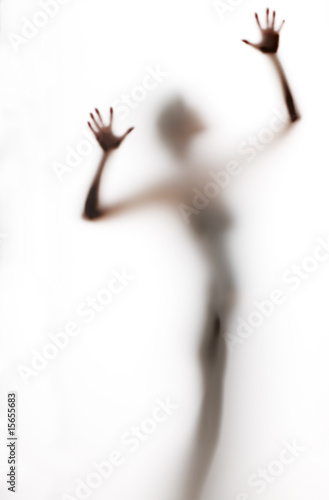 Foto: abstract, elongated, semi-obscured figure with arms raised abstract, elongated, semi-obscured figure with arms raised