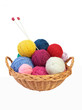 Colorful knitting yarn and needles in a basket