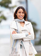 Foto: Smiling woman with arms crossed Smiling woman with arms crossed
