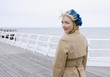 A woman on a boardwalk at the beach