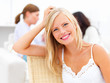 Closeup portrait of a pretty blond woman smiling