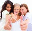 Portrait of happy young friends showing thumbs up sign