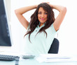 Portrait of a smiling young business woman sitting on chair