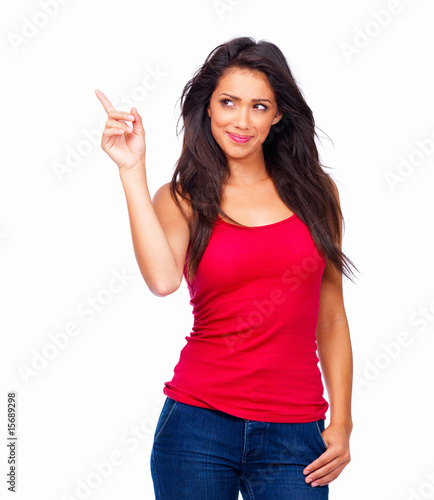 Photo: Smiling young lady in red top standing against isolated white Smiling young lady in red top standing against isolated white