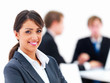 Young beautiful woman and businesspeople in background