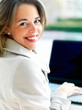 side view of beautiful woman using laptop
