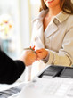 Woman paying for purchases through credit card