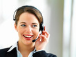 Closeup of young receptionist talking on microphone