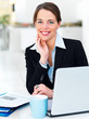 Successful young businesswoman with laptop computer
