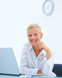 Beautiful business woman Smiling by laptop at desk