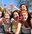 teenage fans screaming and reaching out for a celebrity