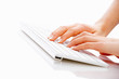 Foto: Human hand typing on computer keyboard Human hand typing on computer keyboard